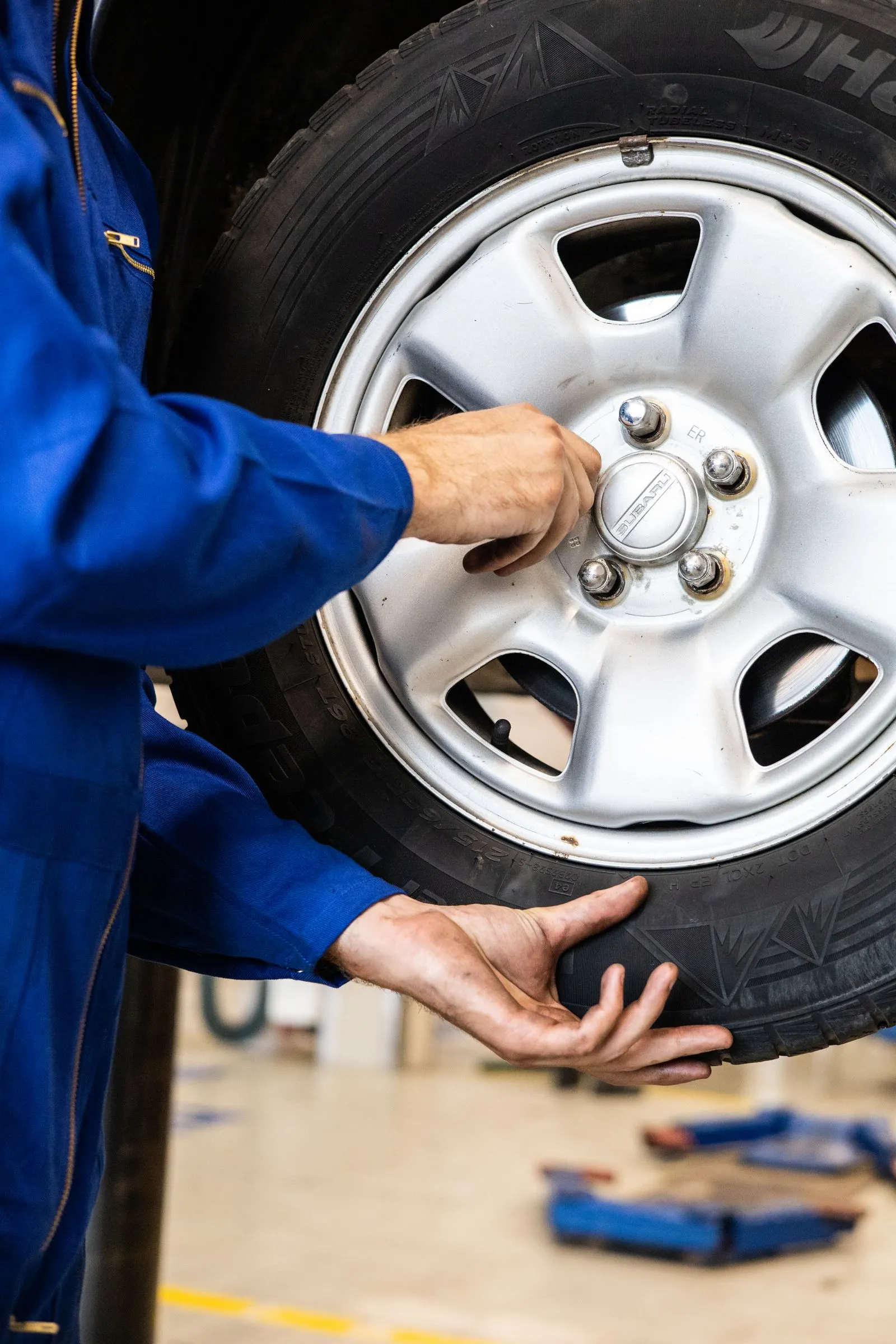 Technician tightening the wheel bolts after a brake service