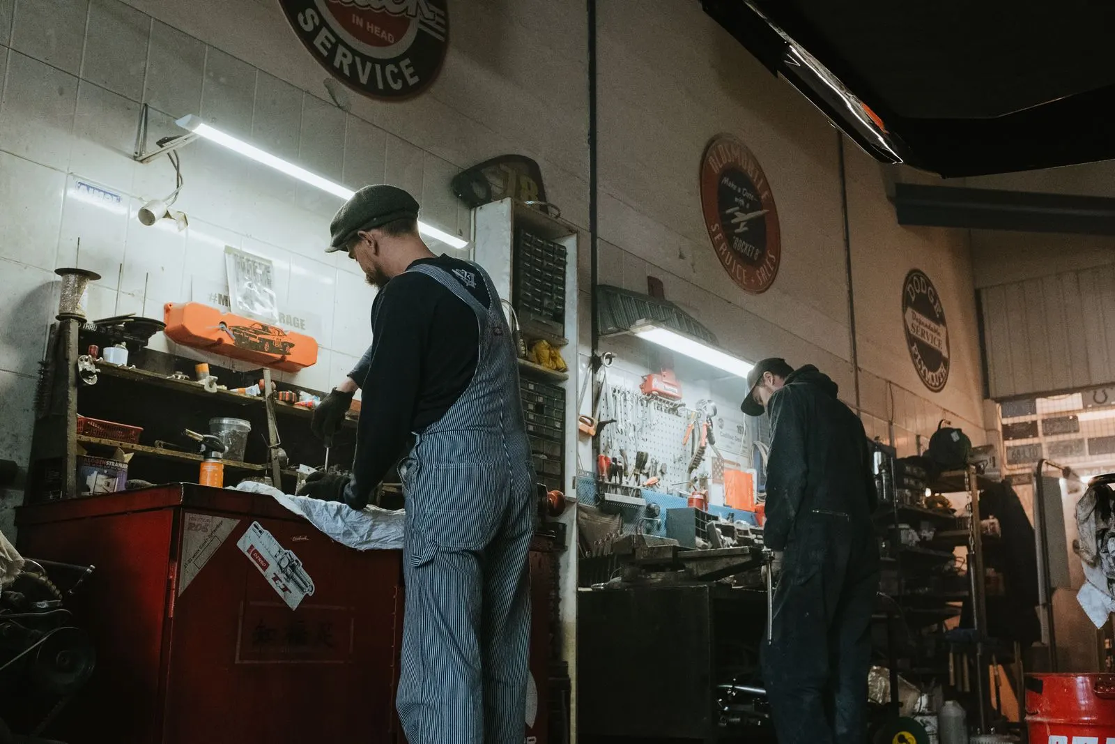 Technicians working in a busy auto repair garage